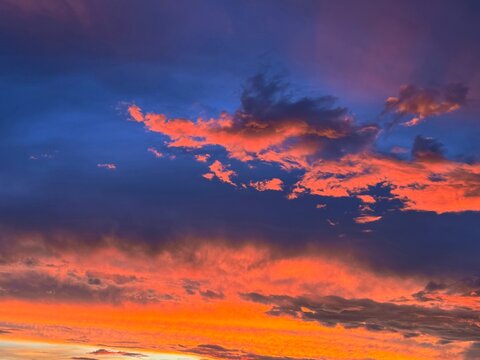 Sunset sky glowing fiery clouds  - Powered by Adobe