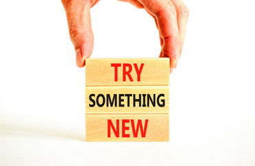 Try something new symbol. Concept words Try something new on beautiful block. Businessman's hand....