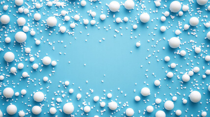 White foam spheres scattered on a blue surface.