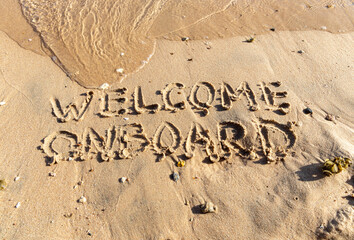 Business welcome onboard concept. Concept word Welcome onboard written on beautiful Red sea sand beach. Beautiful Red sea ocean sand beach background, copy space. Business welcome onboard concept.