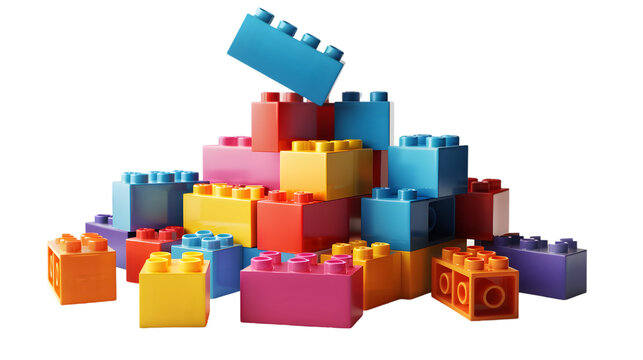 A colorful pile of interlocking plastic building blocks on a  transparent background in studio shot 
