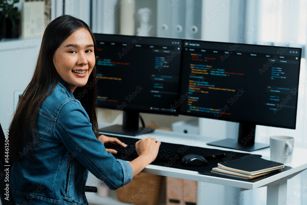 Poster young asian in it developer looking at camera to present with online information on pc with coding p