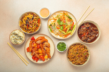 Assorted Chinese dishes, sweet and sour chicken, beef in sauce, noodles, fried rice, salad and...