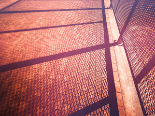 Dramatic light rays coming from the city fence