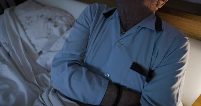 Senior man, pain and stomach ache at night lying sick in bed with Ibs, diarrhea or colon cancer in bedroom. Elderly person with pancreas, gastritis and abdominal discomfort or constipation problem