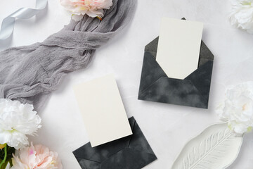 Elegant Wedding Stationery with Envelopes and Flowers