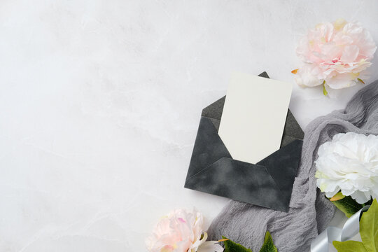 Elegant Wedding Stationery with Floral and Envelope Design