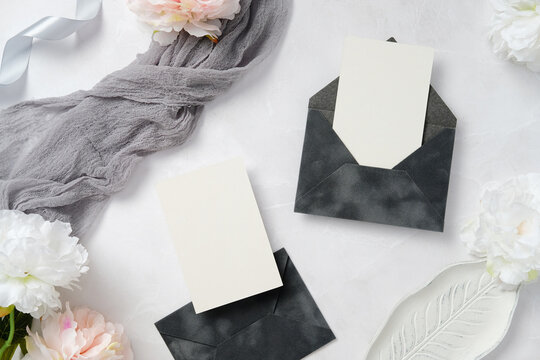 Elegant Wedding Stationery with Envelopes and Flowers