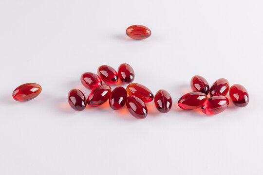 Capsules of omega 3 and vitamin E on a neutral surface