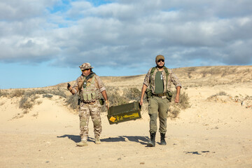 Soldiers Transporting Equipment in Desert Training Exercise