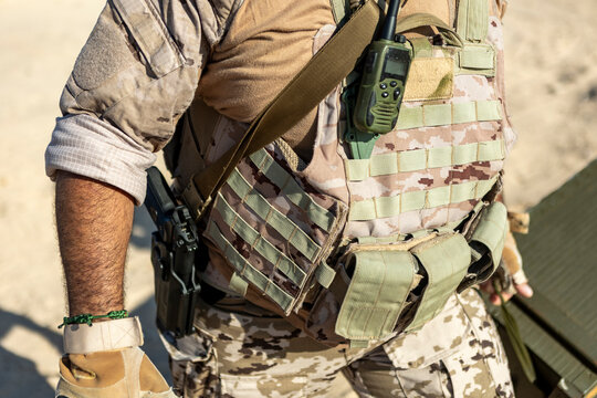 Tactical vest detail in desert surroundings