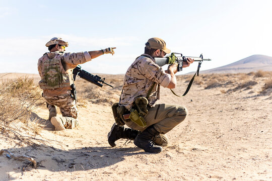 Military Soldiers in Desert Operations on Duty