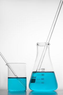 Glassware with blue liquid in laboratory setting