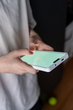 Teen Boy Immersed in Mobile Gaming Sparks Enthusiasm