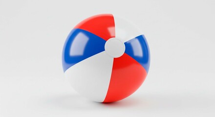 A beach ball with red blue and white panels on a white background in a studio setting with soft lighting