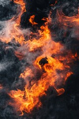 Fototapeta premium A dynamic and captivating blend of vibrant orange flames and swirling smoke against a dark background, creating a dramatic and intense atmosphere suitable for artistic or editorial use