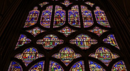 Intricate Quatrefoil Stained Glass Window - A majestic stained glass window, showcasing intricate quatrefoil design, symbolizes faith, spirituality, artistry, history