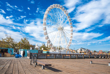 The famous ferris wheel at Bay area, San Francisco. Visitors or tourists take a ride to enjoy...