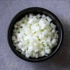 Top view of small black bowl with chopped onion