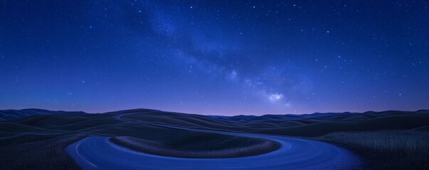 Obraz premium Winding road under a beautiful starfilled night sky landscape