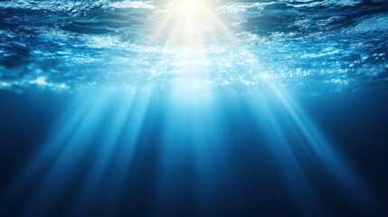 Underwater scene displaying sun rays penetrating the ocean depths