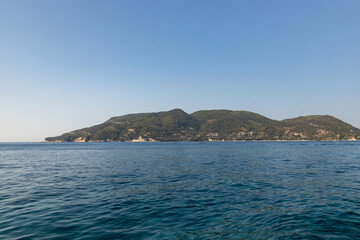 Beautiful view of a rocky island in the blue sea.