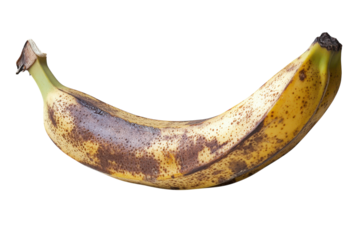 Overripe banana with brown spots a close up shot against a bright white background showcasing its