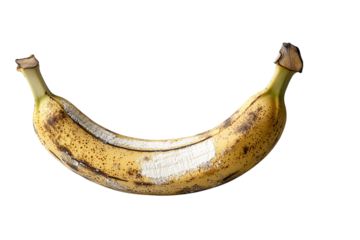 Overripe banana with brown spots and white mold on light grey background soft natural light