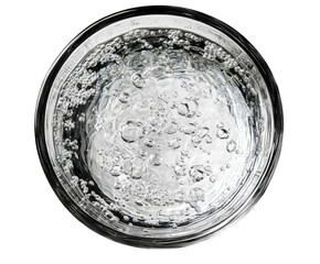Bubbling water action glass drink top view refreshment isolated on transparent background