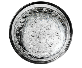 Bubbling water action glass drink top view refreshment isolated on transparent background