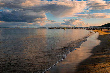 Sunset sky and beautiful old pier on the Baltic Sea in Gdynia, Poland	