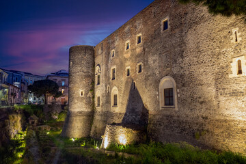 Ursino Castle and Moat in Catania, Sicily, Italy, artificially illuminated at night