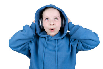 A young girl wearing a blue hooded sweatshirt and headphones reacts with surprise, looking up with wide eyes and an open mouth. Shot against a transparent backdrop