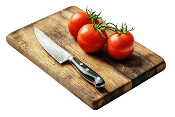 Fresh vine tomatoes on rustic wooden board ready for slicing with sharp kitchen knife Warm lighting
