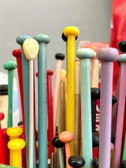 knitting needle retro background 60s 70s closeup various craft hobby colorful