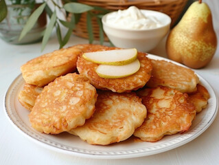Delicious golden brown pear fritters on a plate