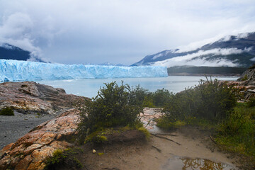 calving glacier in patagonia south america with mountains © Steve