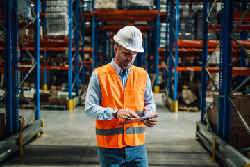 Warehouse manager using digital tablet and controlling inventory in large distribution center