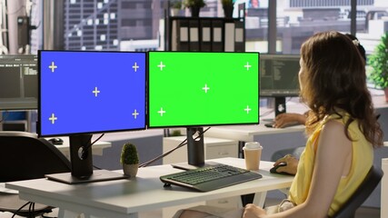 Developer using multi monitor isolated screen PC to create machine learning models that can process data to automate decision making processes. Woman programming using mockup computer, camera A