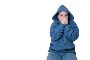 Young person in blue hoodie with a sad gaze, looking directly at camera with hands near face. Isolated on transparent background