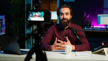 Influencer entering home studio, doing live broadcast for online streaming platforms, talking with...