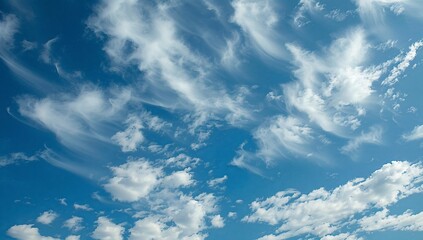 Vast, vibrant sky filled with wispy, scattered clouds