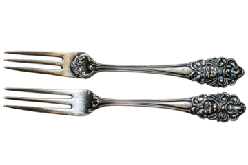 Elegant antique silver forks detailed ornate handles vintage tableware neutral background