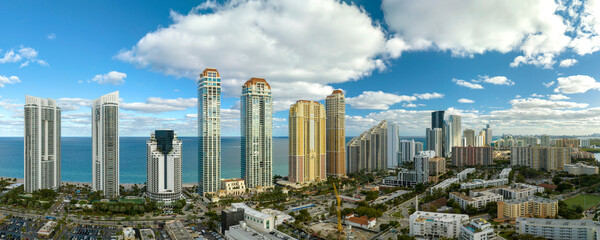 Expensive highrise hotels and condos on Atlantic ocean shore in Sunny Isles Beach city. American tourism infrastructure in southern Florida