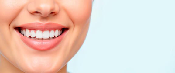 Obraz premium Smiling woman showcasing perfect teeth against a light background 