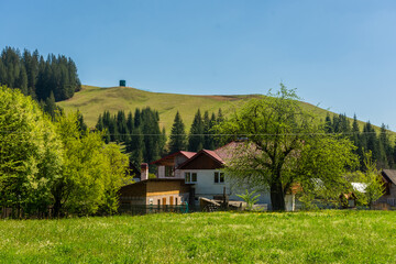 Wooden hut in the hills of Bucovina,  at the border between Ukraine and Romania