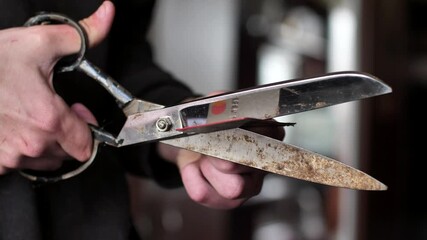 credit card. rusty scissors cutting bank card.