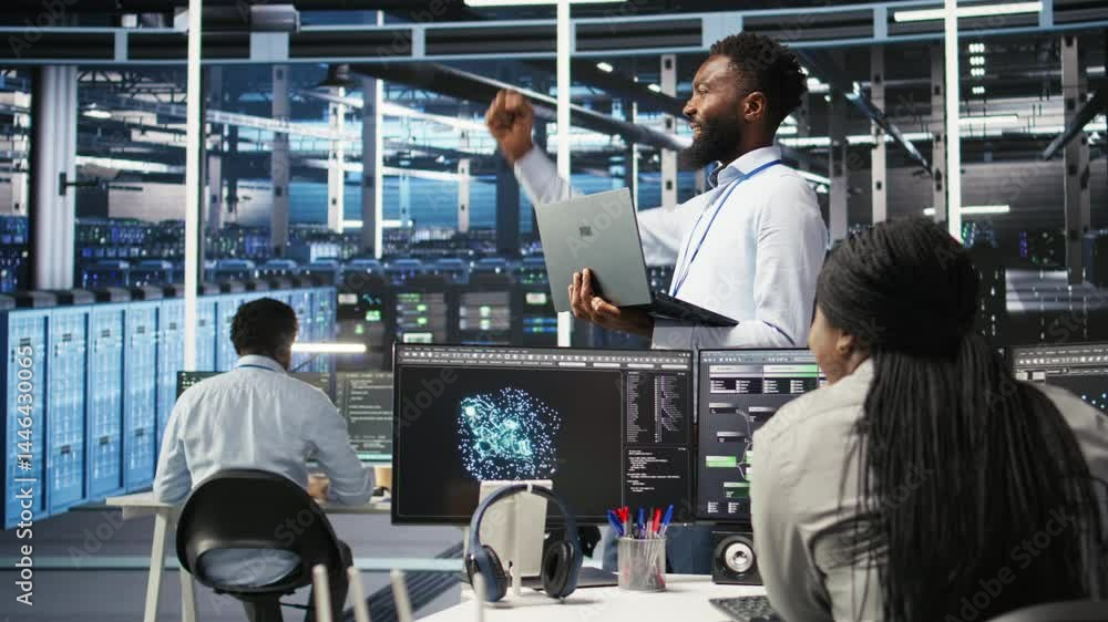 Poster happy data center admin uses node tree programming on laptop, doing high five with coworker. smiling