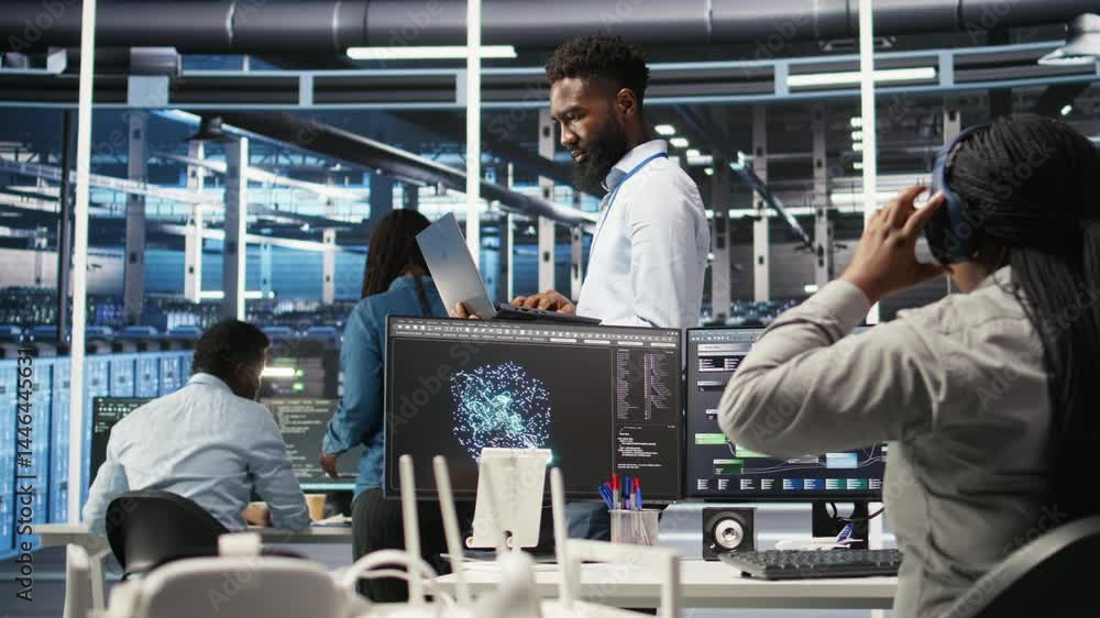 Poster happy data center admin uses node tree programming on laptop to identify equipment performance issue