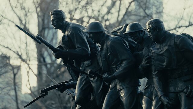 NEW YORK, USA - FEBRUARY 14, 2025 - Bronze statue of american soldiers charging with rifles in their hands in a park of Manhattan, New York City